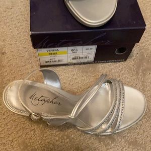 Used only once Silver size 6 1/2 strappy heel
